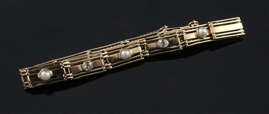 An early 20th century 15ct gold, split pearl and diamond gate link bracelet, gross 18.6 grams.